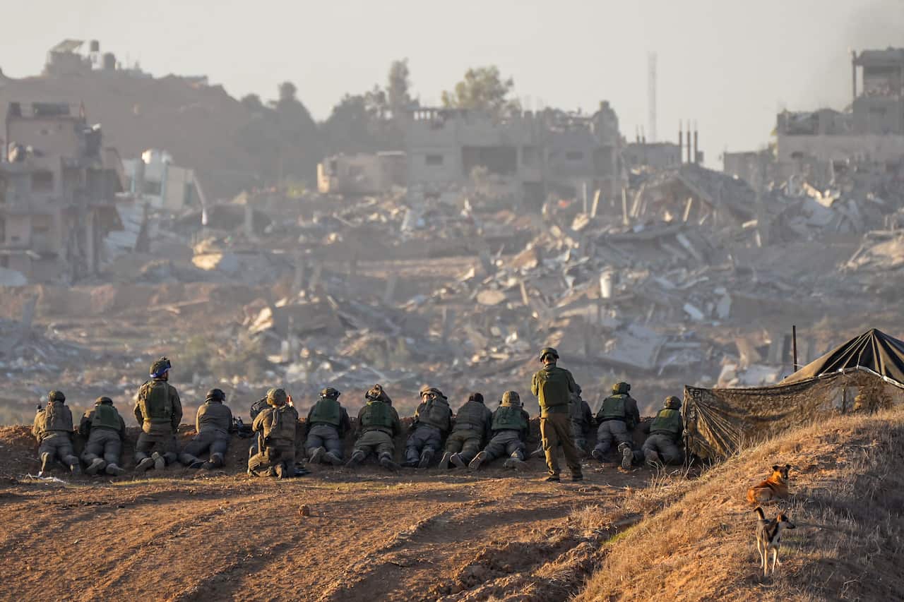 Soldiers in a line looking out.