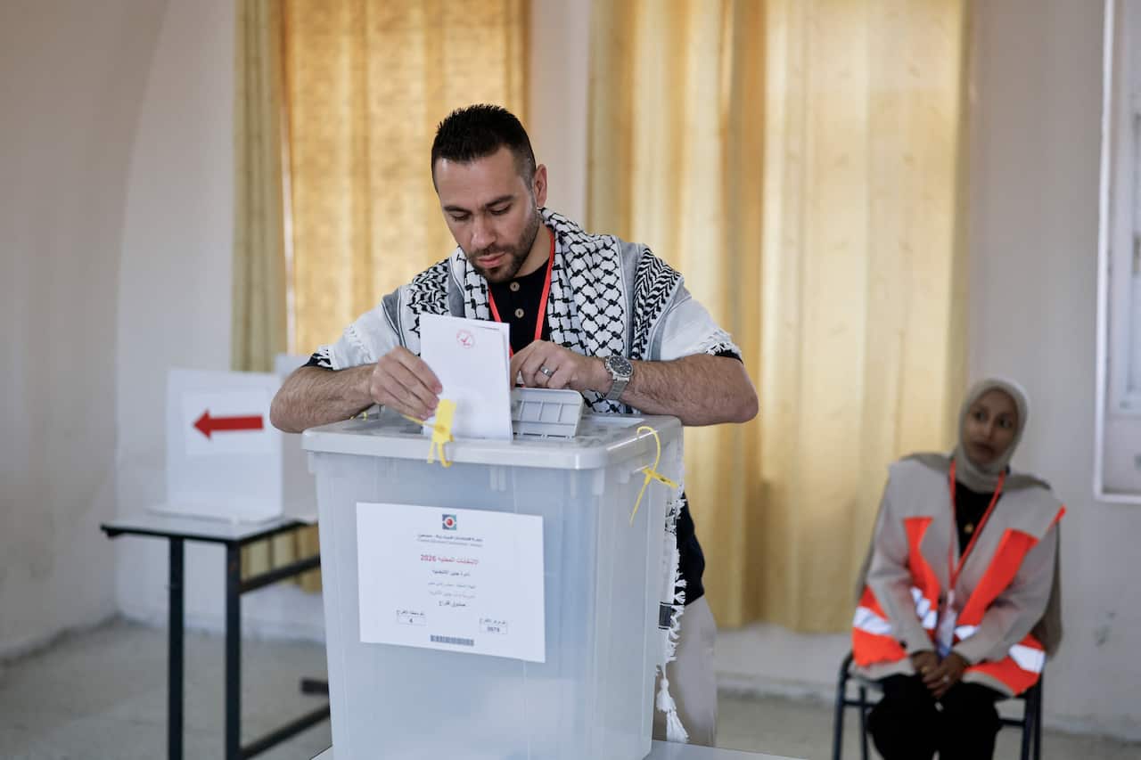 A man casts his vote at a polling station