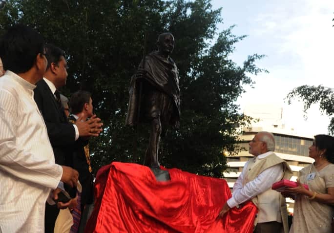 Mr Modi unveils a statue of Mahatma Gandhi in Brisbane during his visit in 2014.