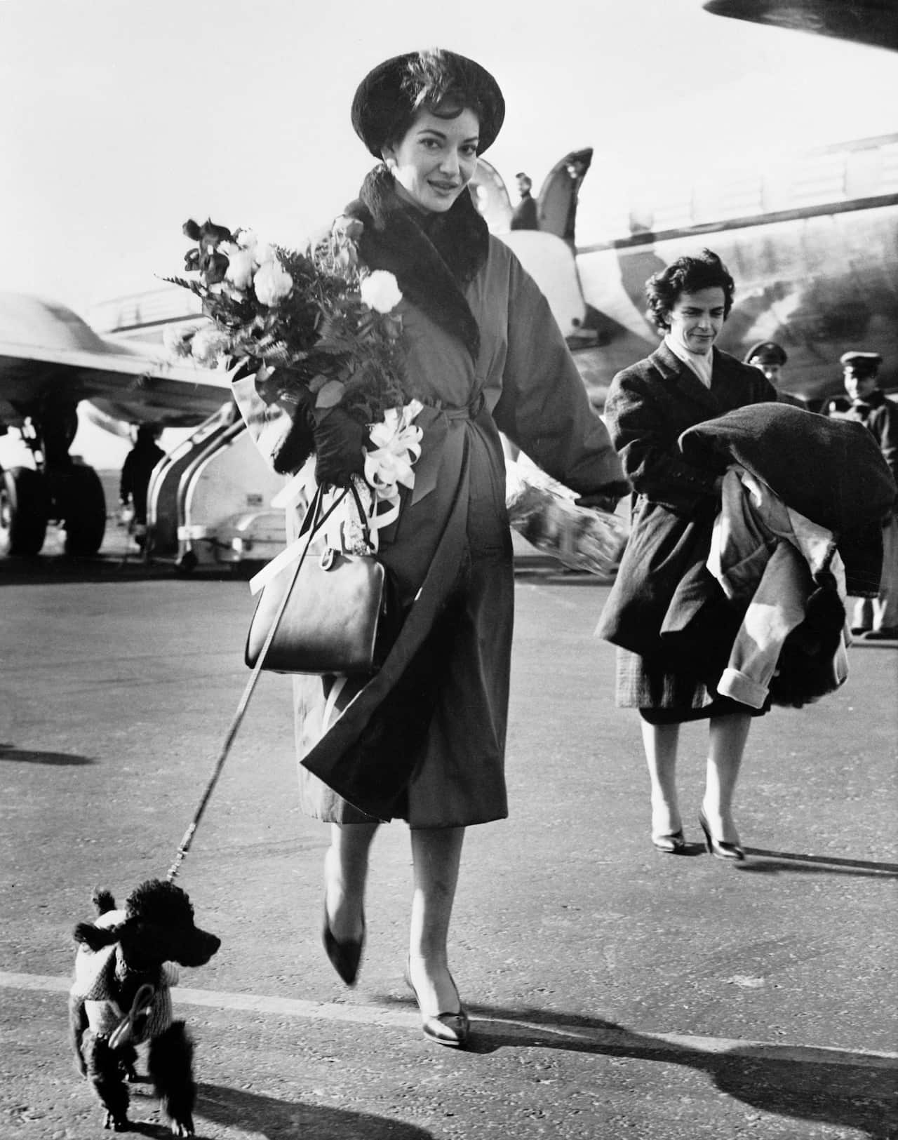 Maria Callas and Dog Arriving at Airport
