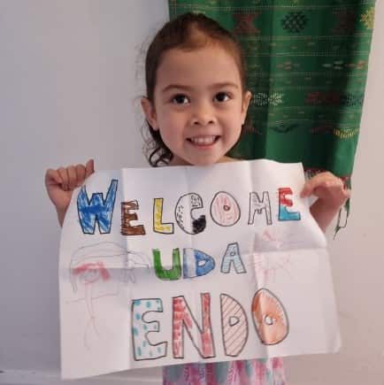 Endo's four-year-old niece holds a hand drawn sign meant to welcome him to Australia. 