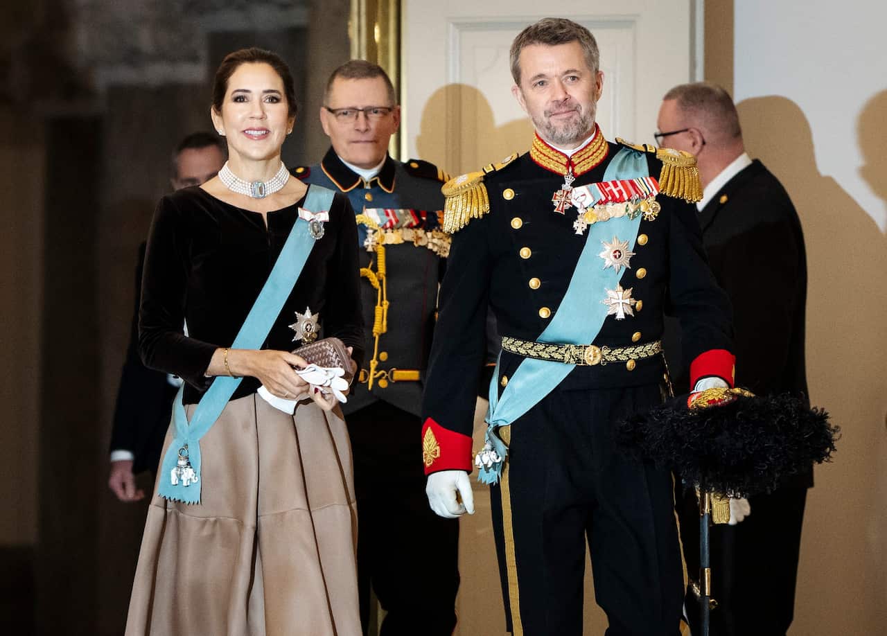 Denmark's Crown Prince Frederik (right) and Crown Princess Mary in regal attire arrive at Christiansborg Palace in Copenhagen, Denmark.