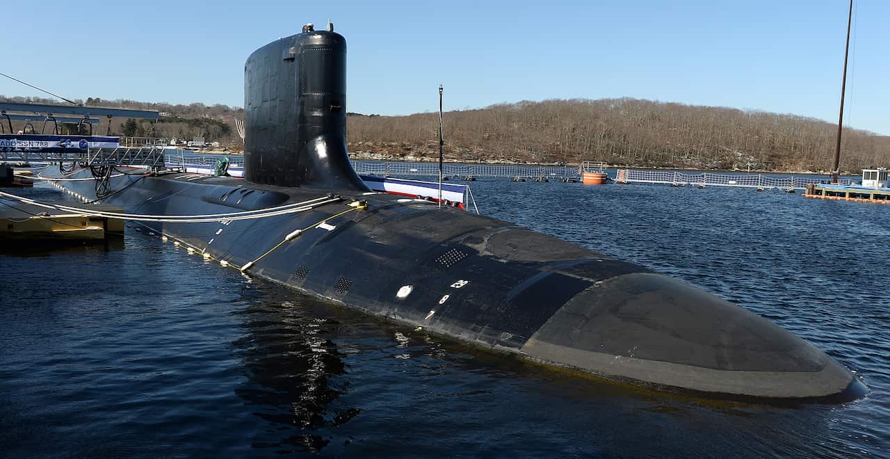 A US Virginia-class nuclear submarine at a dock