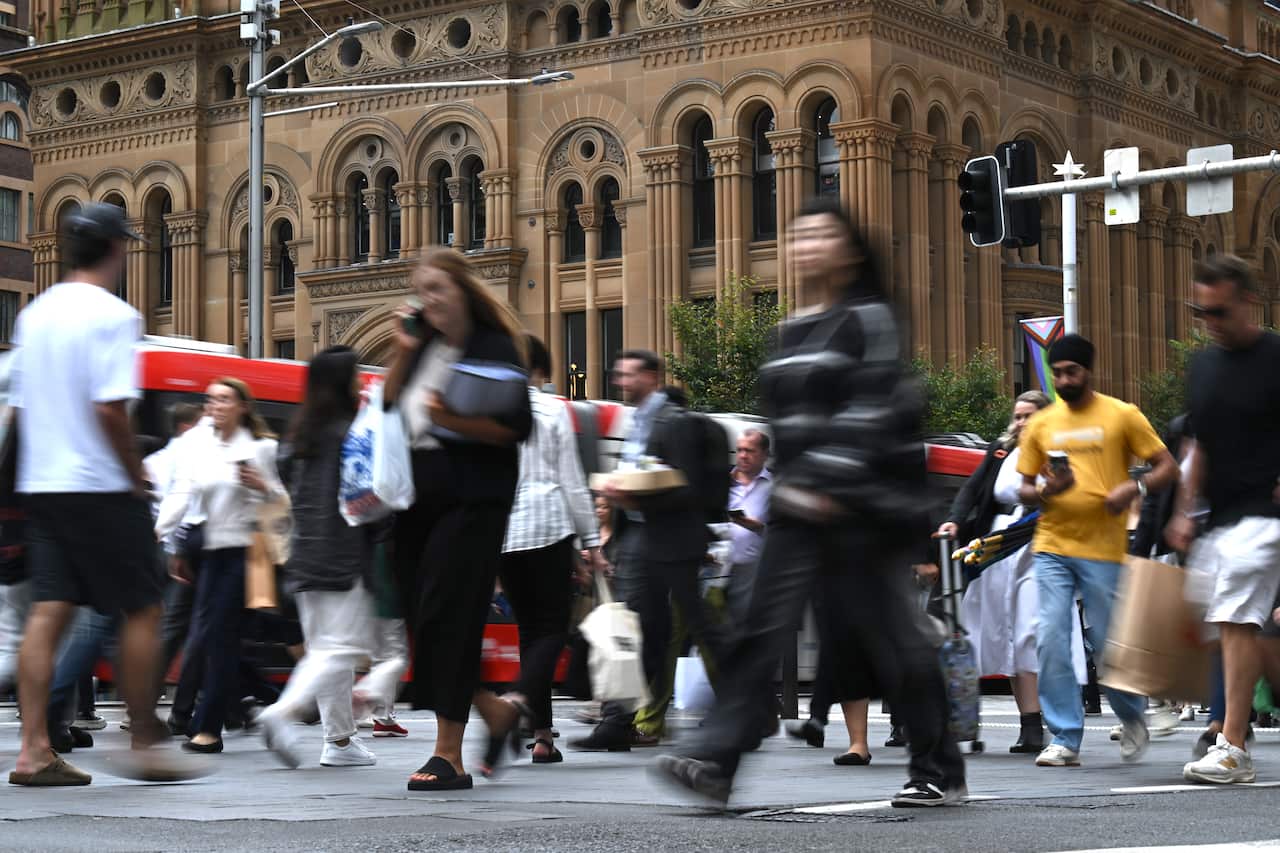 Pedestrians walking on a street.