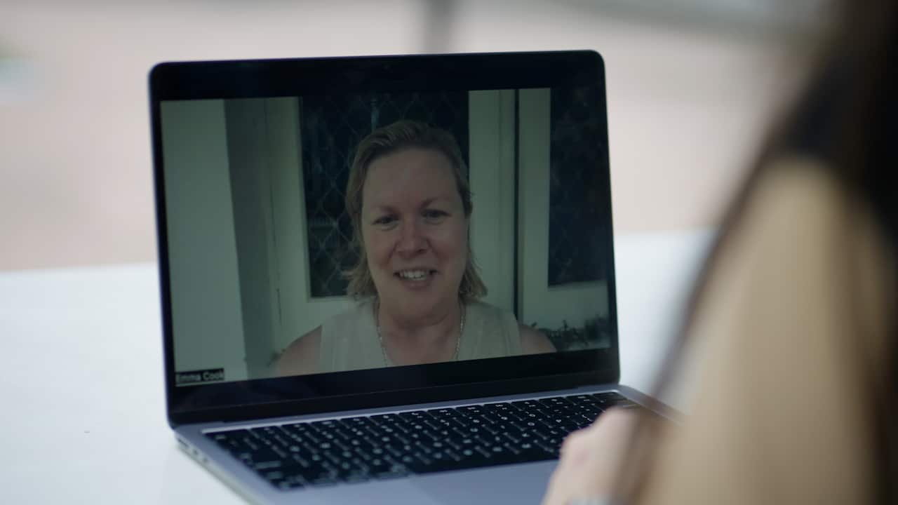 Laptop with a lady on a video call. 