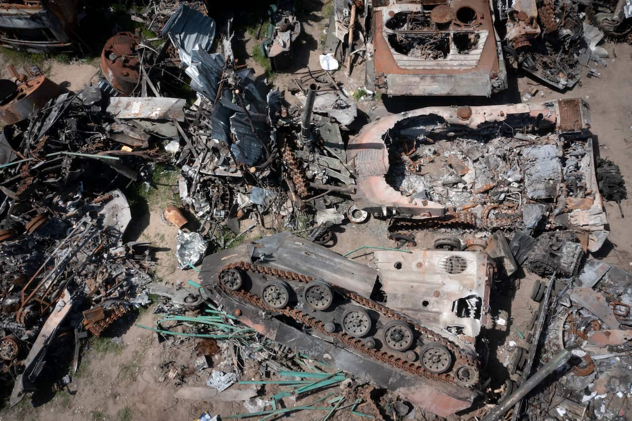 Destroyed Russian military vehicles lie in a garbage dump in Bucha, on the outskirts of Kyiv.