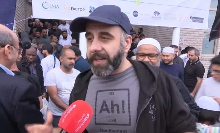 A man with a cap standing