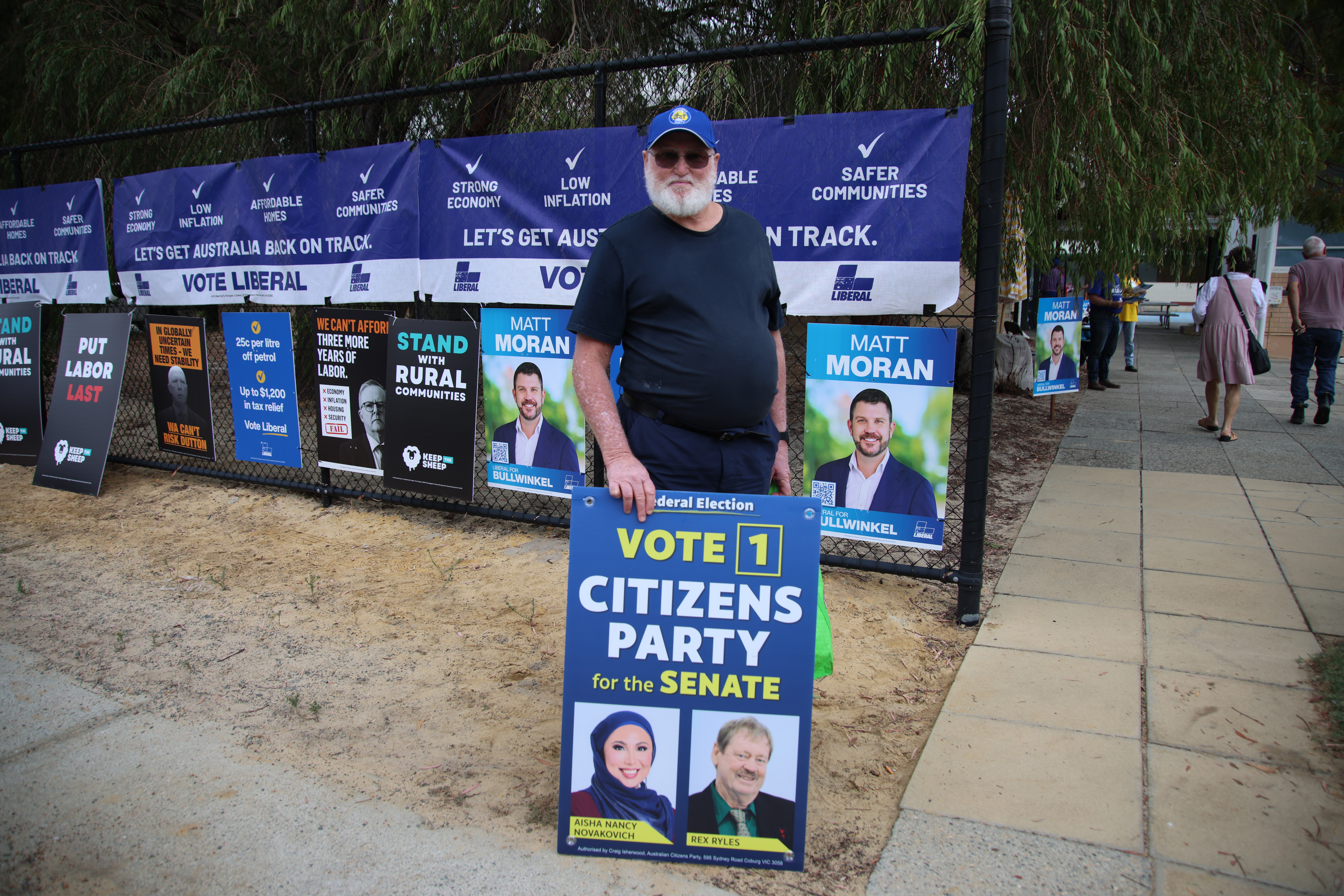 A volunteer outside a polling station 