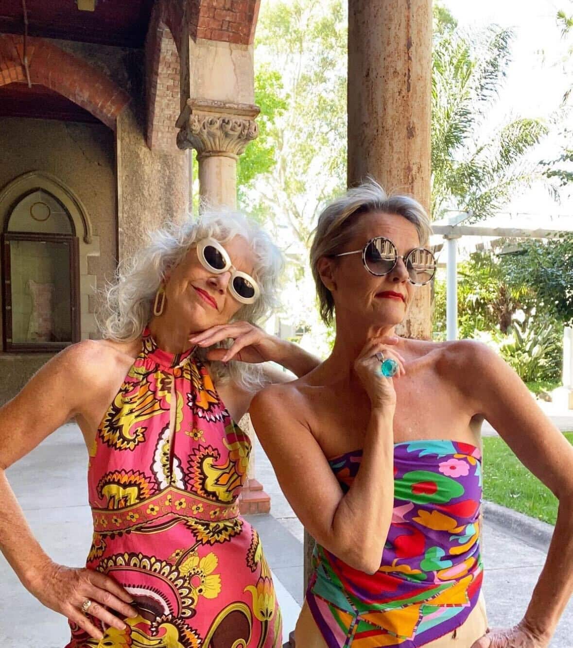 two older women in colourful outfits