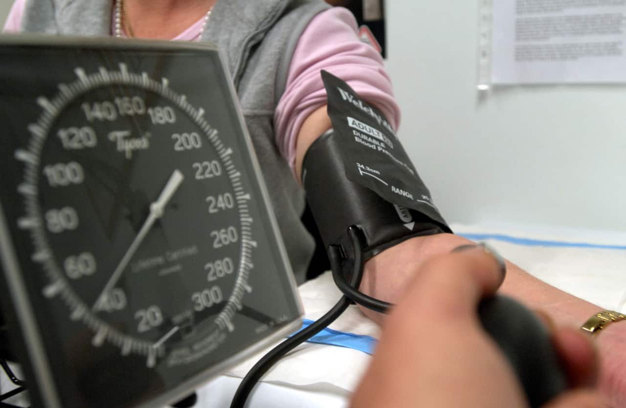 A patient having their blood pressure checked