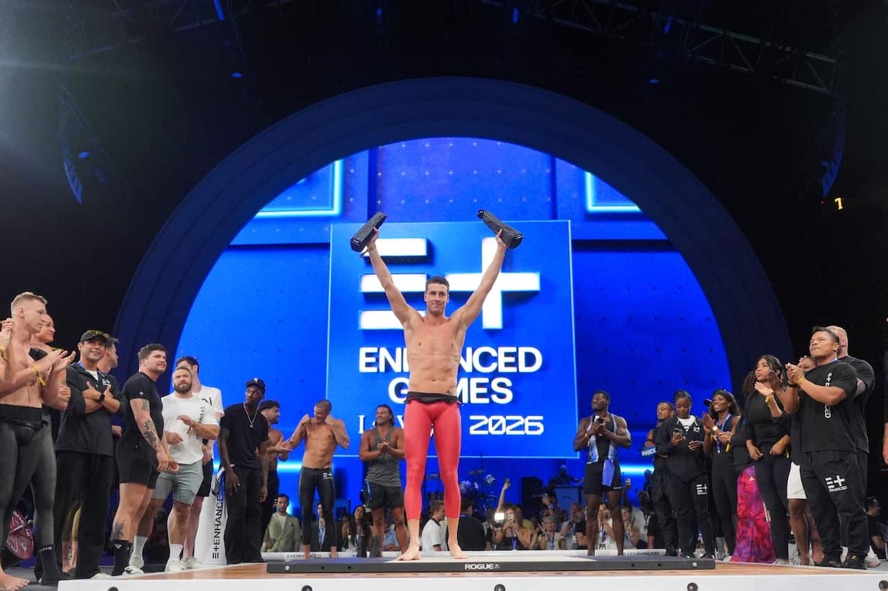 Swimmer Kristian Gkolomeev, of Greece, holds up his trophies during an award ceremony at the Enhanced Games in Las Vegas, May 24, 2026. (AP PhotoJae C. Hong).jpg