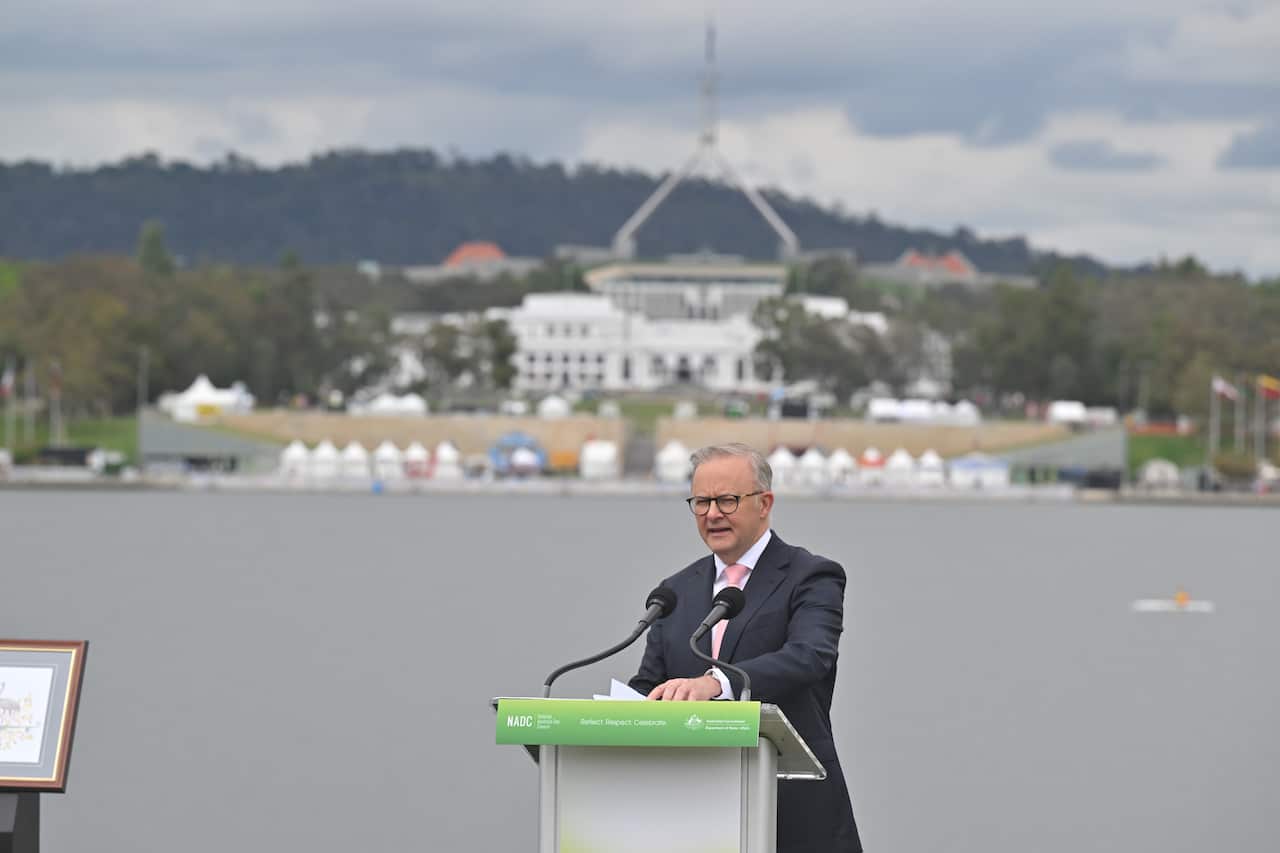Anthony Albanese speaking at a podium.