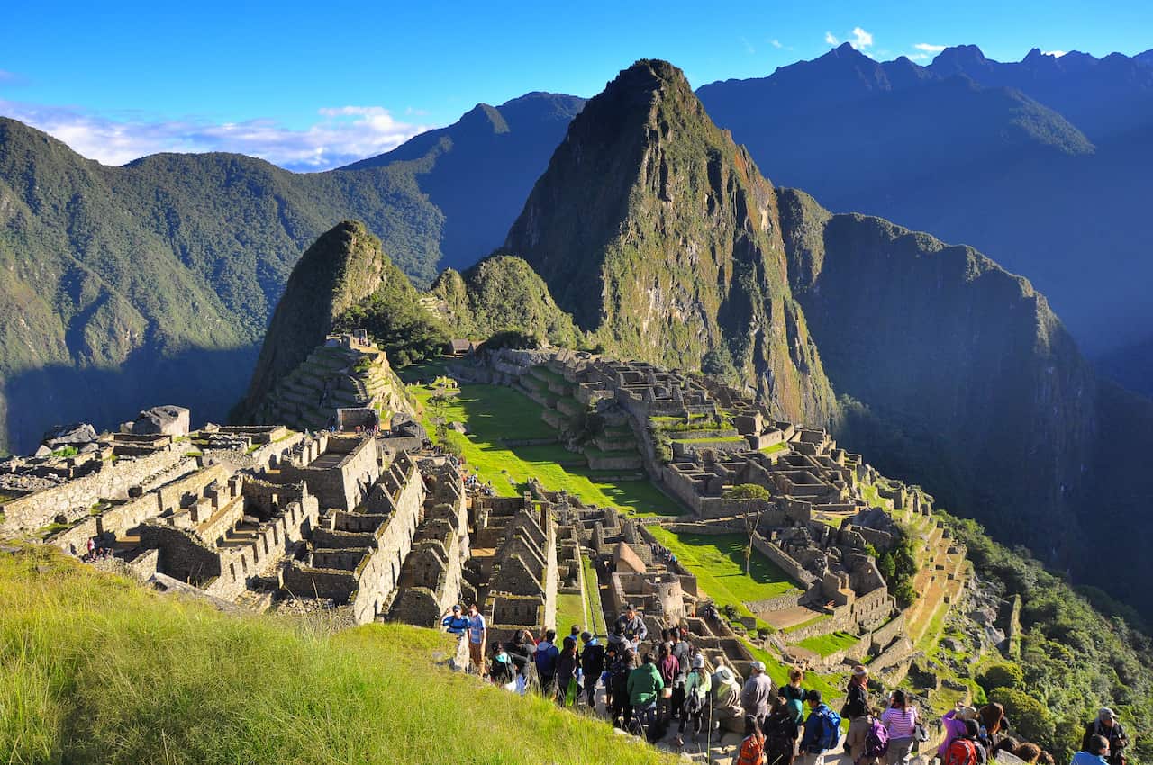 Tourists walk to Machu Picchu 