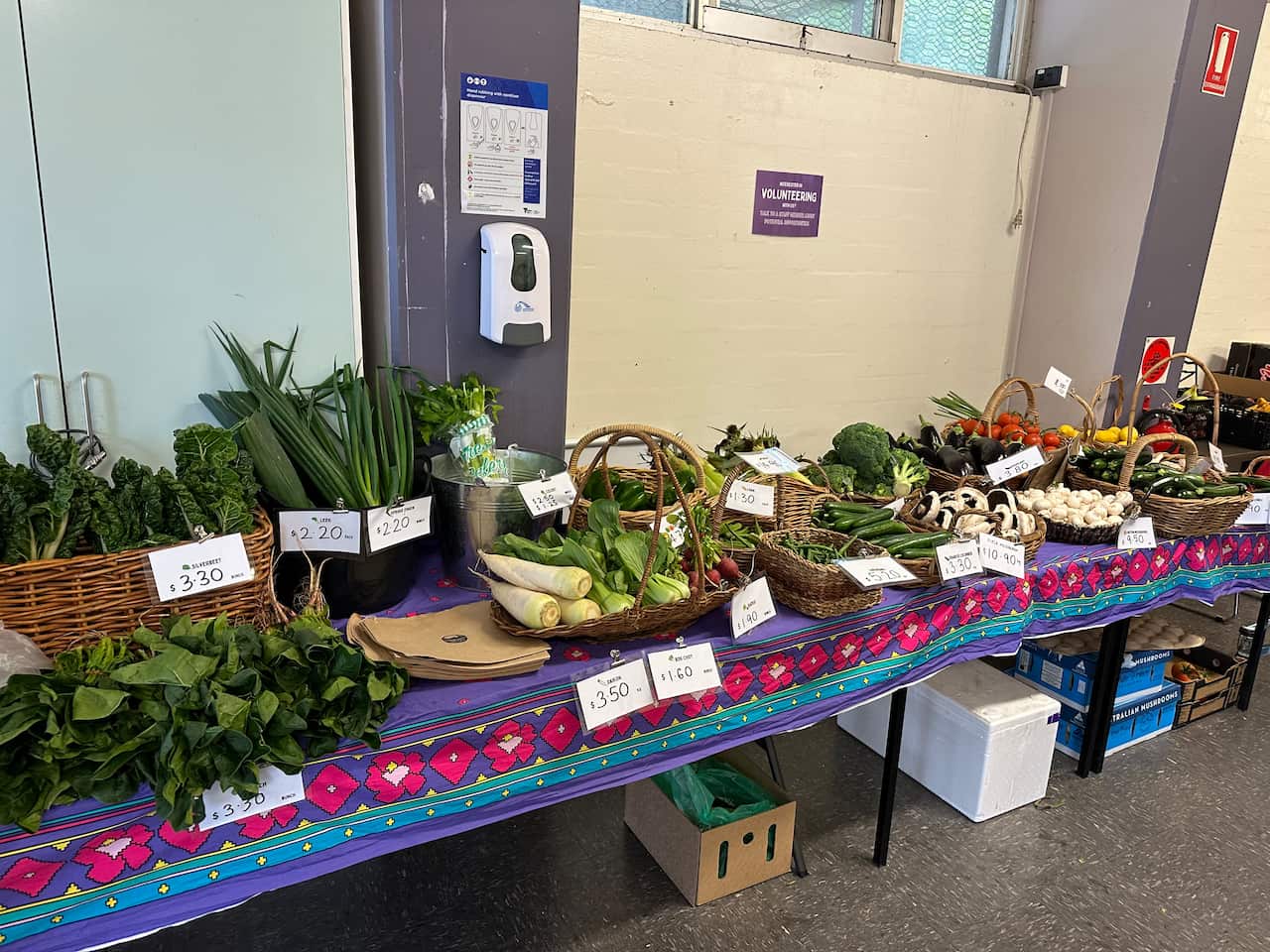 A table with several types of vegetables on it for sale