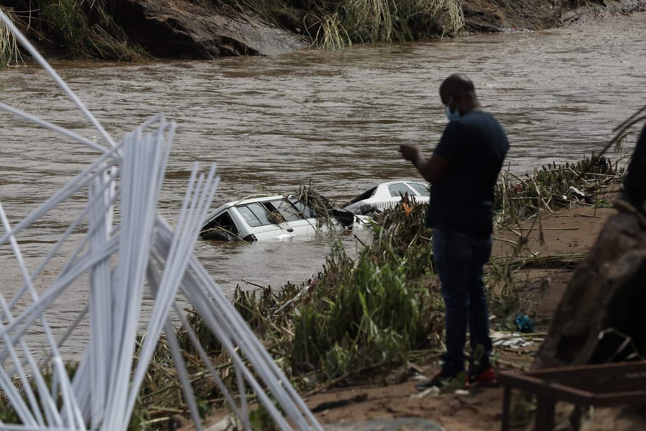 Two cars are submerged in flood waters near Durban. 