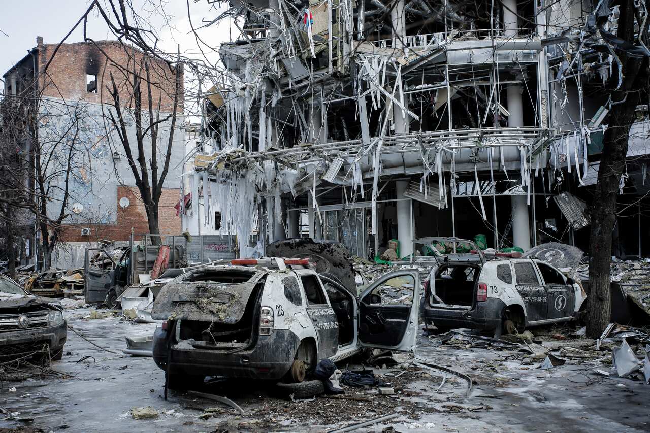 Damaged vehicles and buildings are seen in the city centre of Kharkiv, Ukraine.