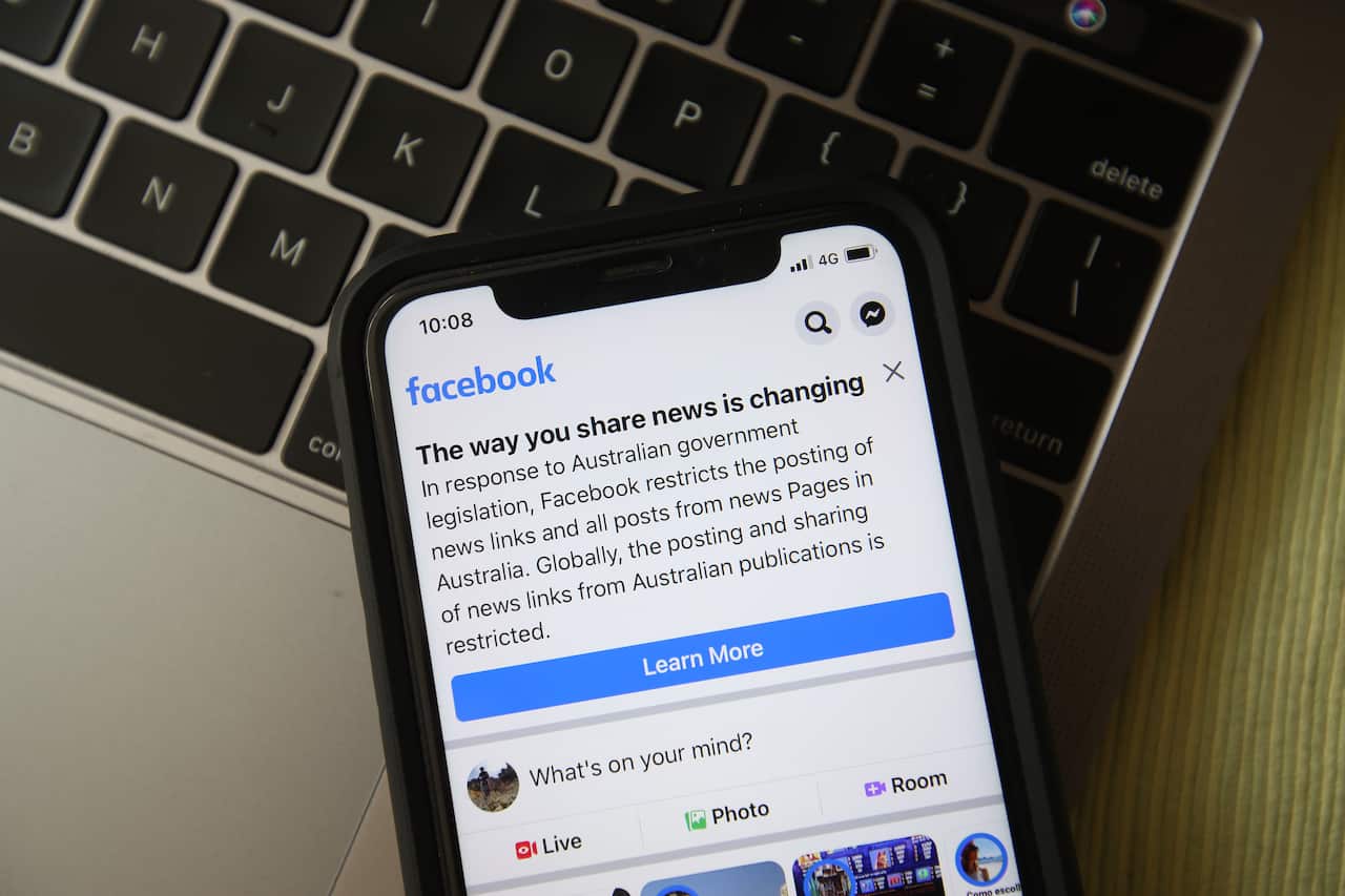 In this photo illustration, a message is seen on Facebook mobile, on February 18, 2021 in Melbourne, Australia. Facebook banned publishers and users in Australia from posting and sharing news content for more than one week.