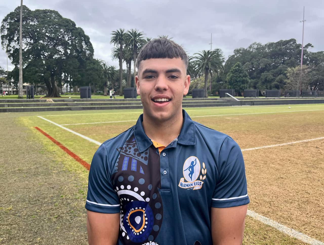 Bayden Moran looking at camera on the footy field