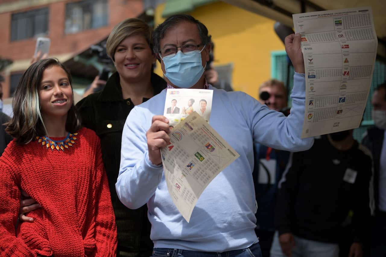 Colombian presidential pre-candidate Gustavo Petro is seen holding a ballot paper.