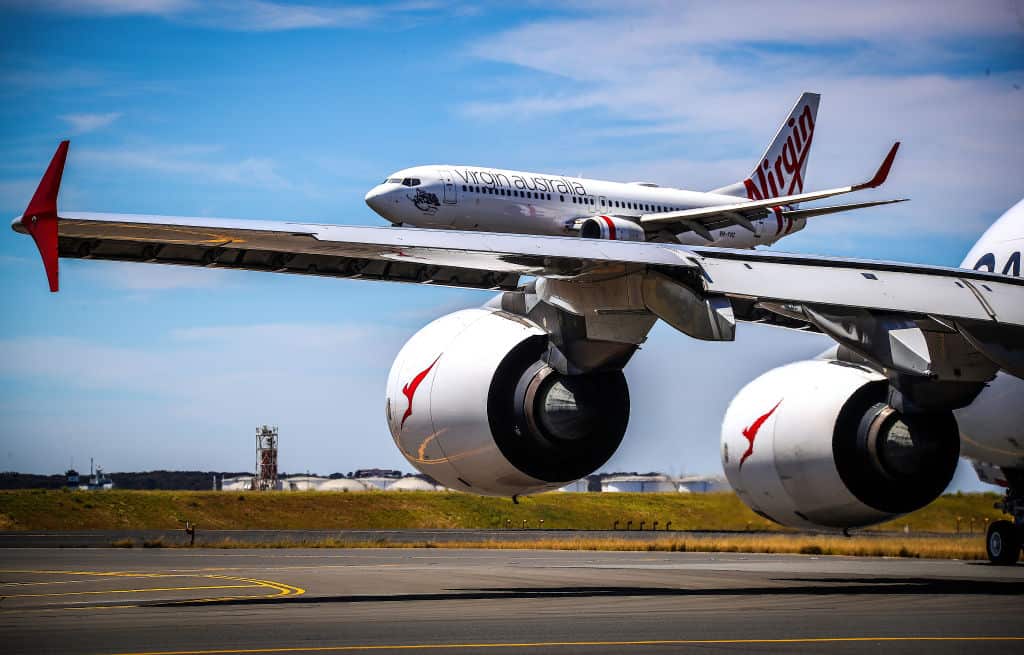 A Qantas and Virgin Airlines plane at Sydney International Airport.