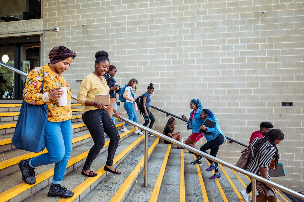 Students going in both directions up and down stairs.