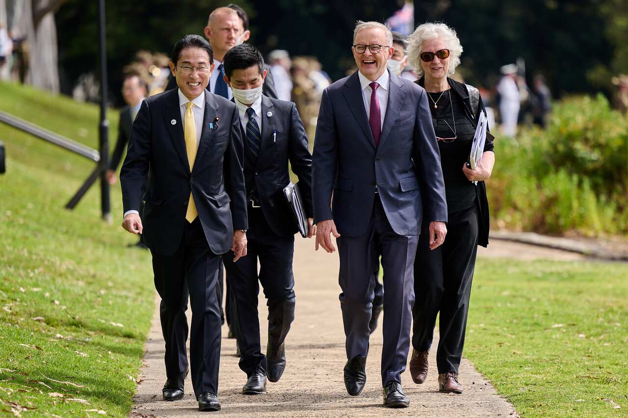 Japanese Prime Minister Fumio Kishida and Australian Prime Minister Anthony Albanese walking side by side.