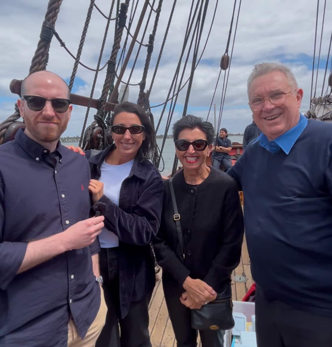 A family of four on a ship.