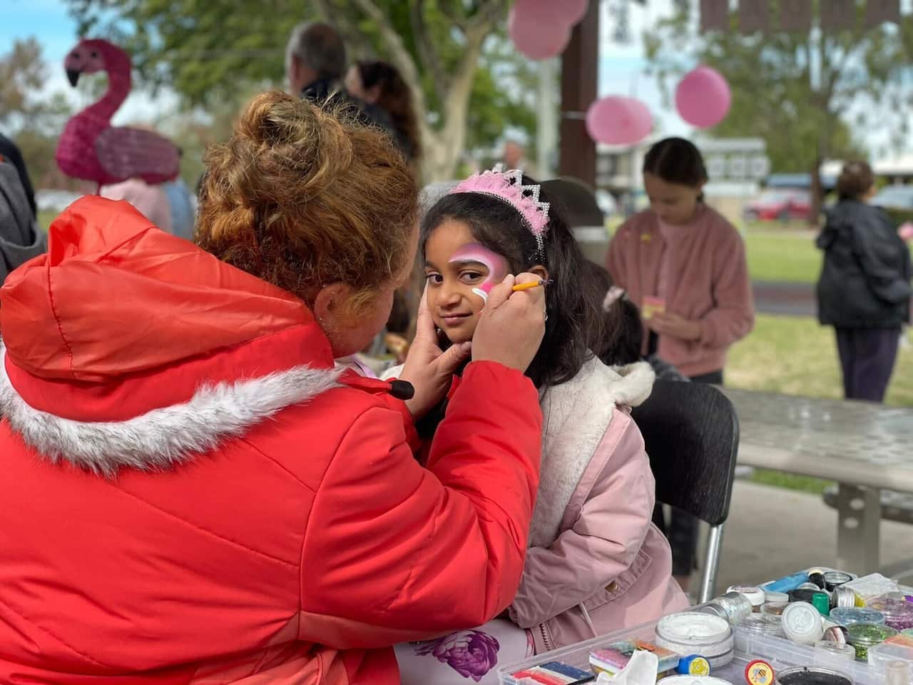 A girl getting her face painted