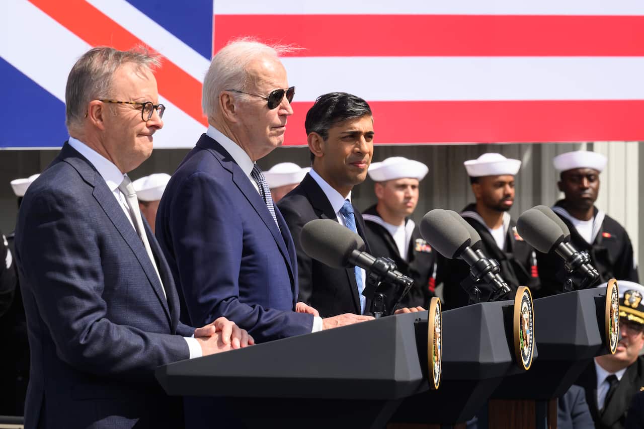 Anthony Albanese, Joe Biden and Rishi Sunak stand at lecterns to announce the AUKUS deal
