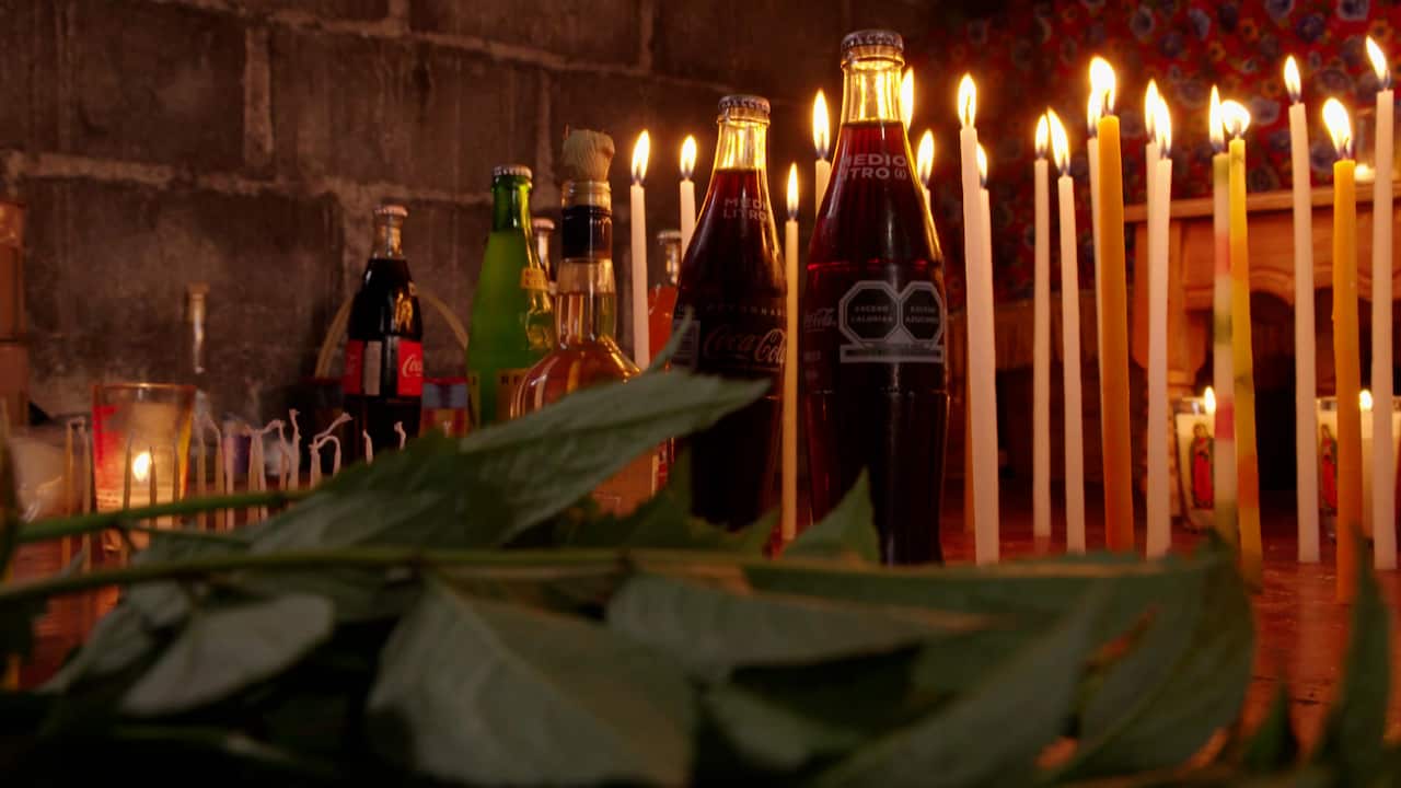 Bottles of Coca-Cola in a shrine. 