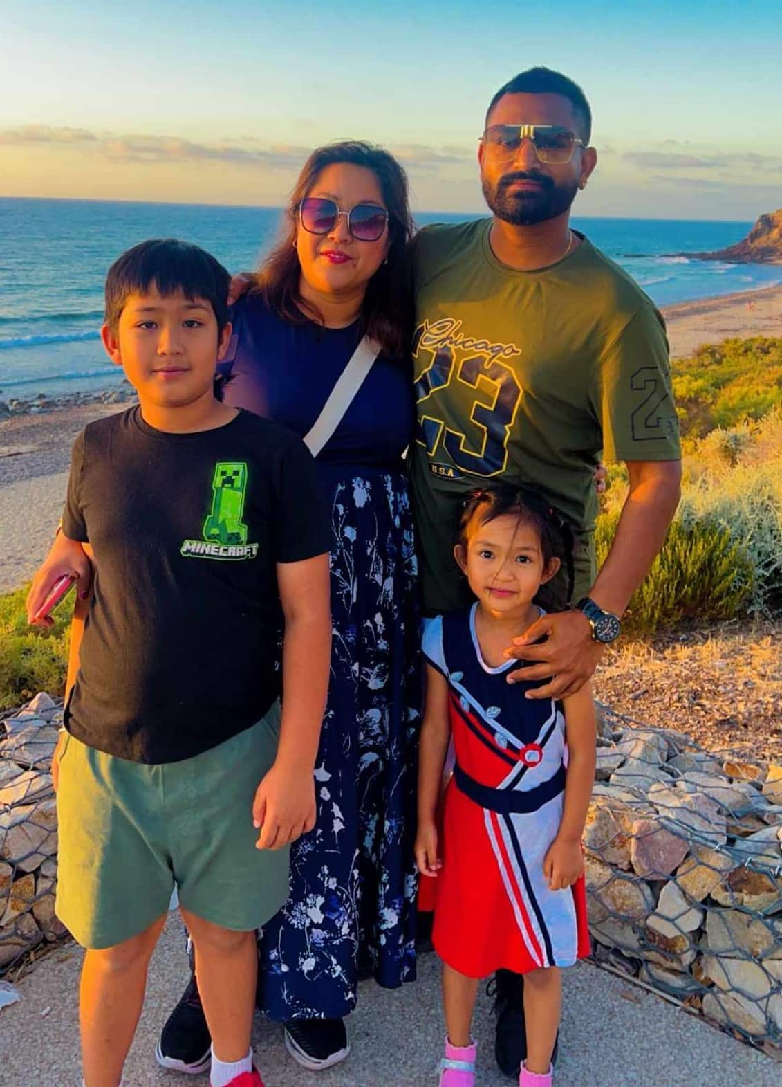 Millie and Preet with their children enjoying holidays