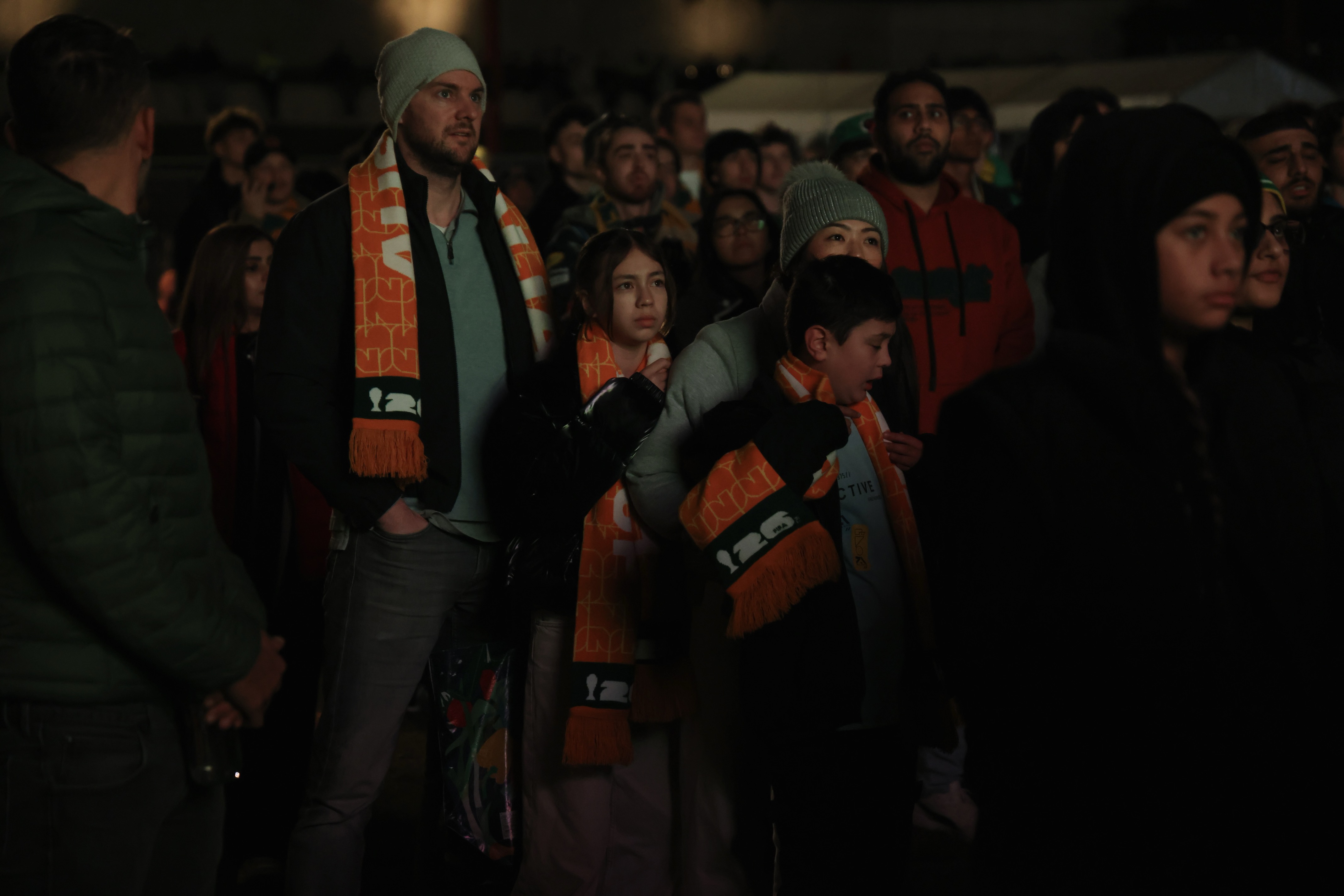 Socceroos fans wearing scarves