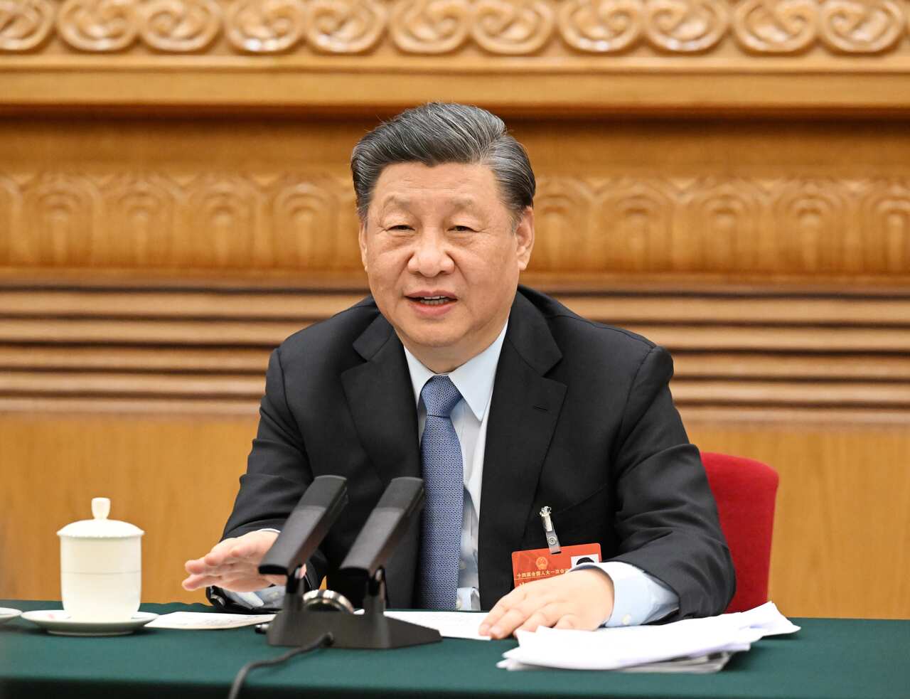 Chinese President Xi Jinping takes part in a deliberation with his fellow deputies from the delegation of Jiangsu Province, at the first session of the 14th National People's Congress NPC in Beijing.