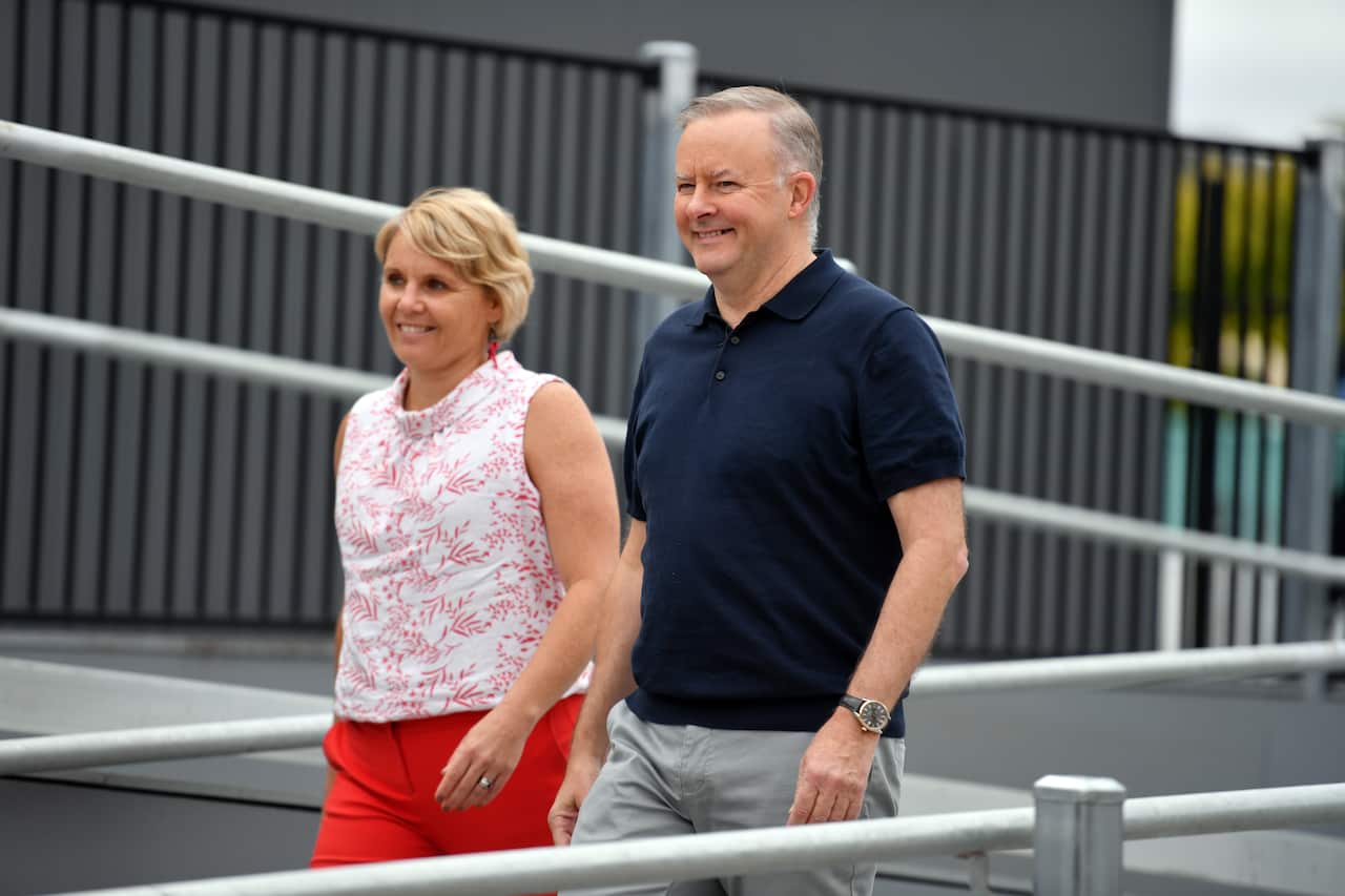 Anthony Albanese walks with Peta Murhpy.