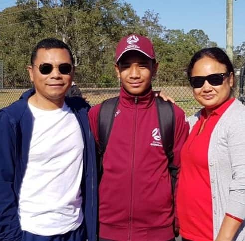 Anshu Ale (C) with his parents.
