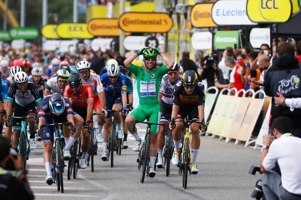 Mark Cavendish reacts as he crosses the line in the green jersey at the 2021 Tour de France
