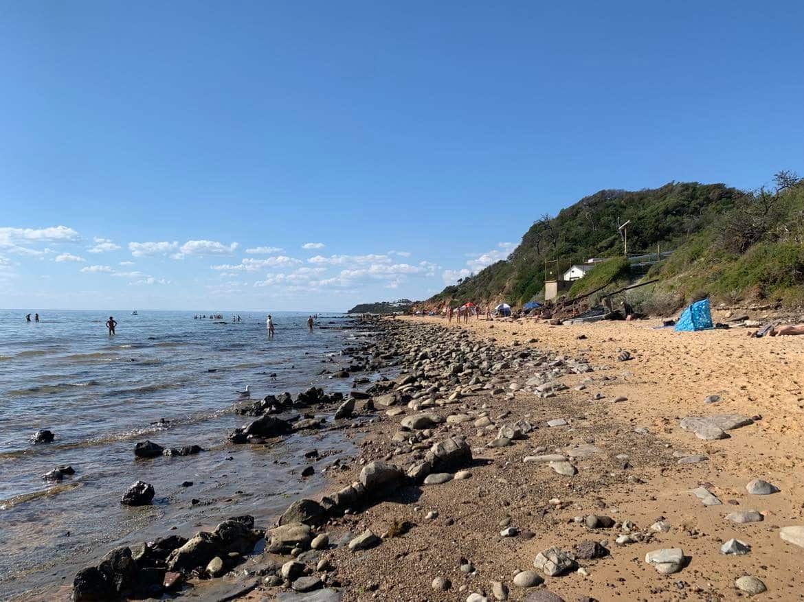 The sea, a beach and a headland in the distance.