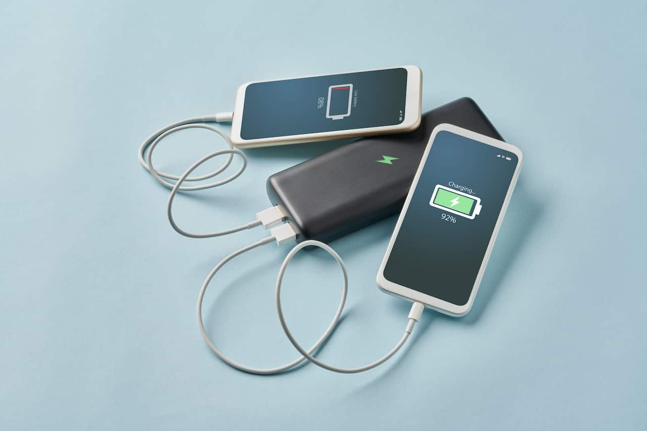 Smart Phone Connected To Portable Charger