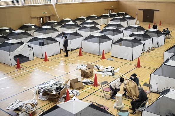 Small tents set up in a gynmasium to shelter residents following earthquake in Japan