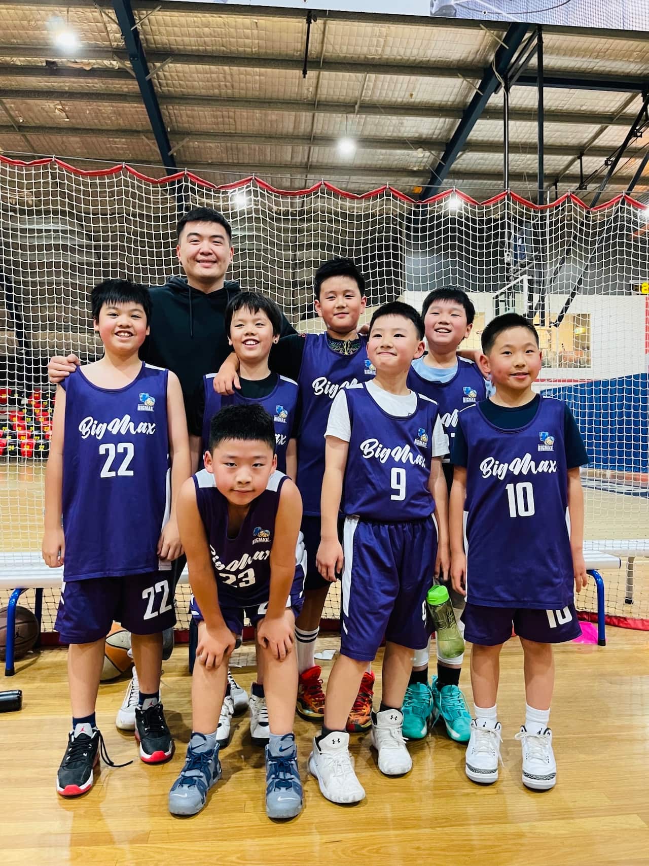 Basketball coach Mr. Yan and his team.jpeg
