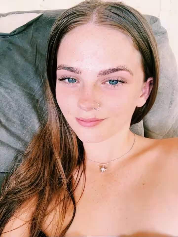 A girl taking a selfie.