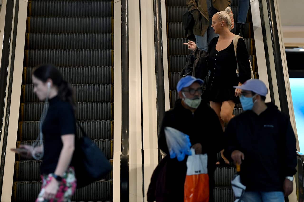 People on an escalator.