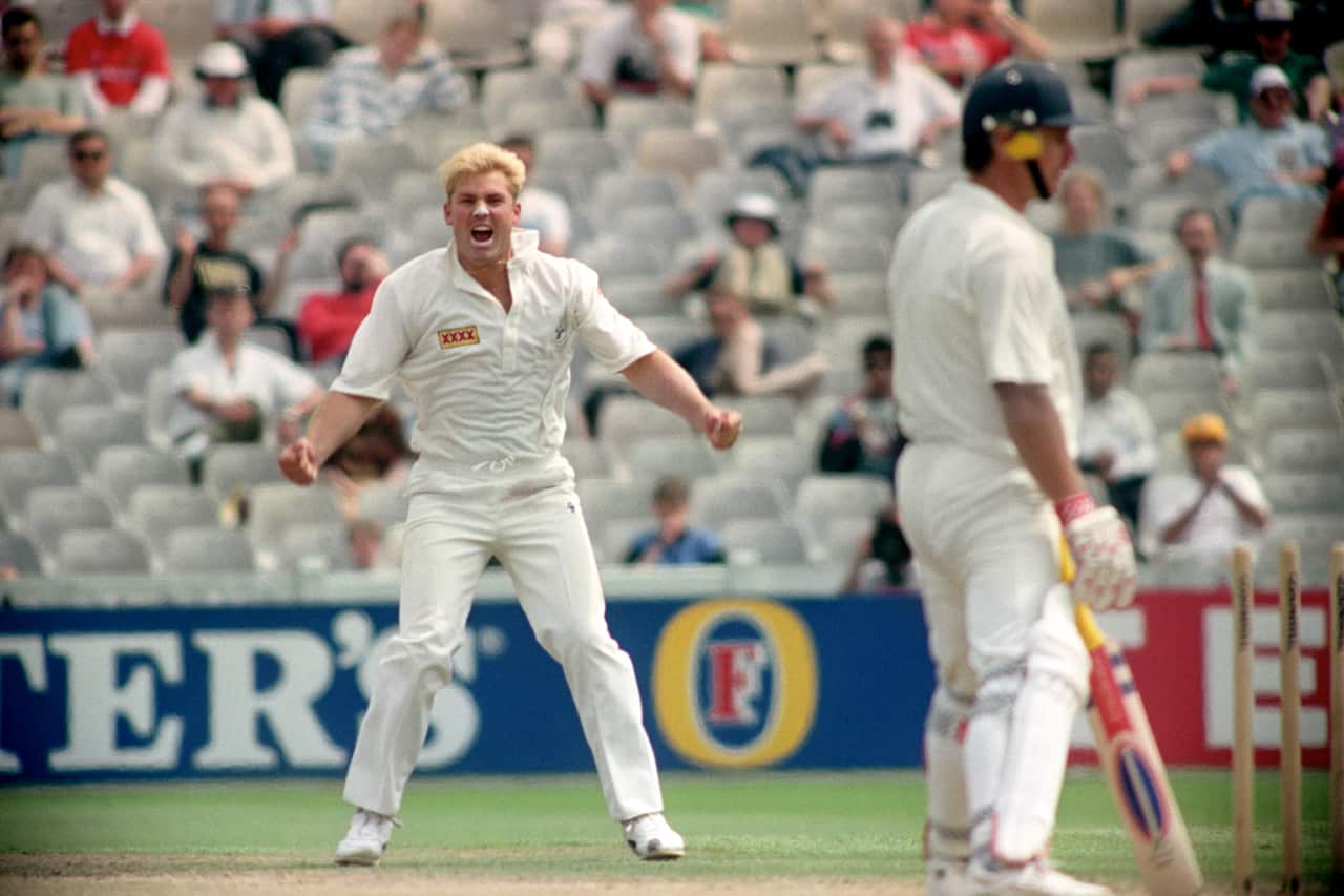Shane Warne is seen with an excited look on his face.