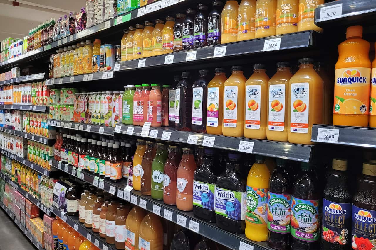View of various brands concentrates fruit flavour juices bottles on the shelves in Mercato supermarket, Penang.