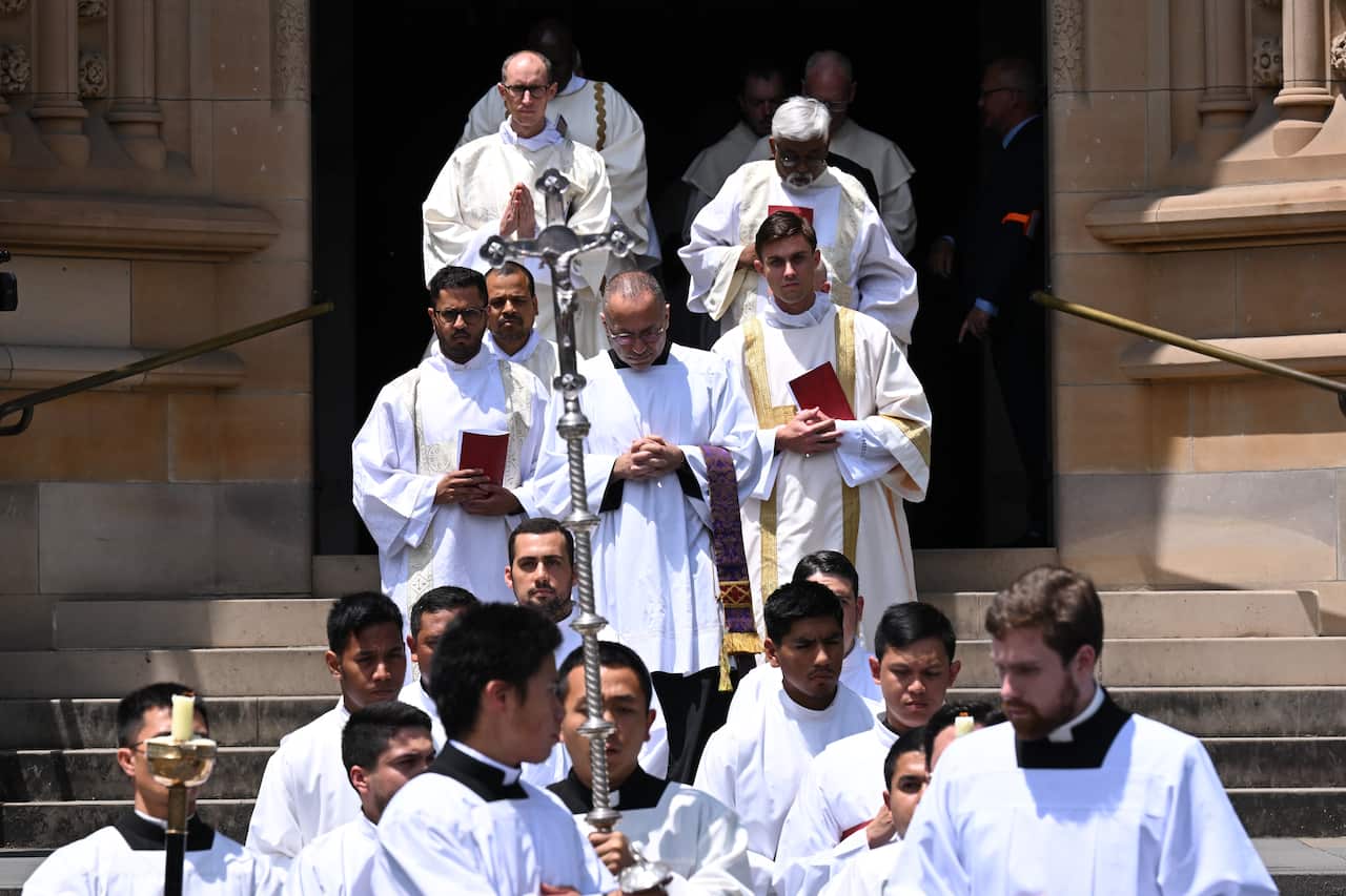 Bishops walking out of a church.
