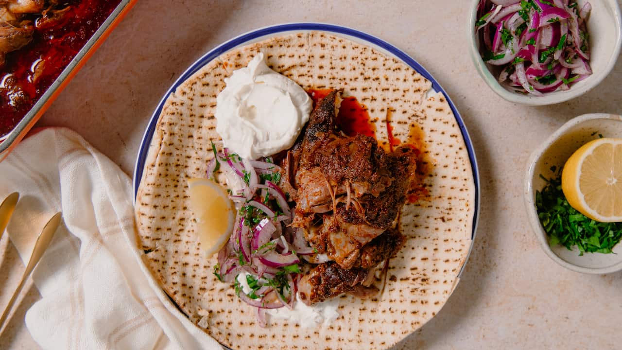 Slow-roasted lamb shoulder with tahini dip