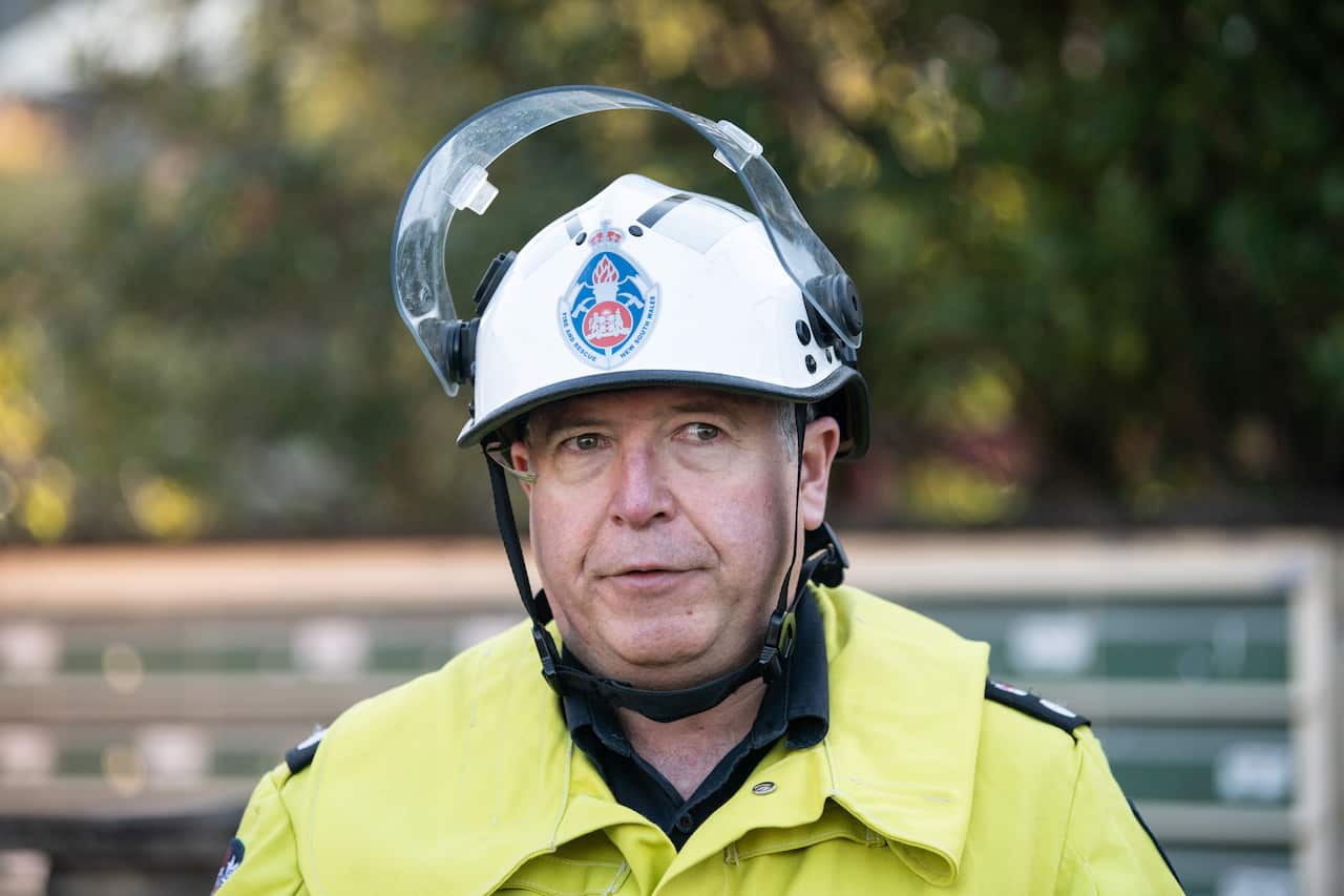 A man in firefighting uniform and hardhat