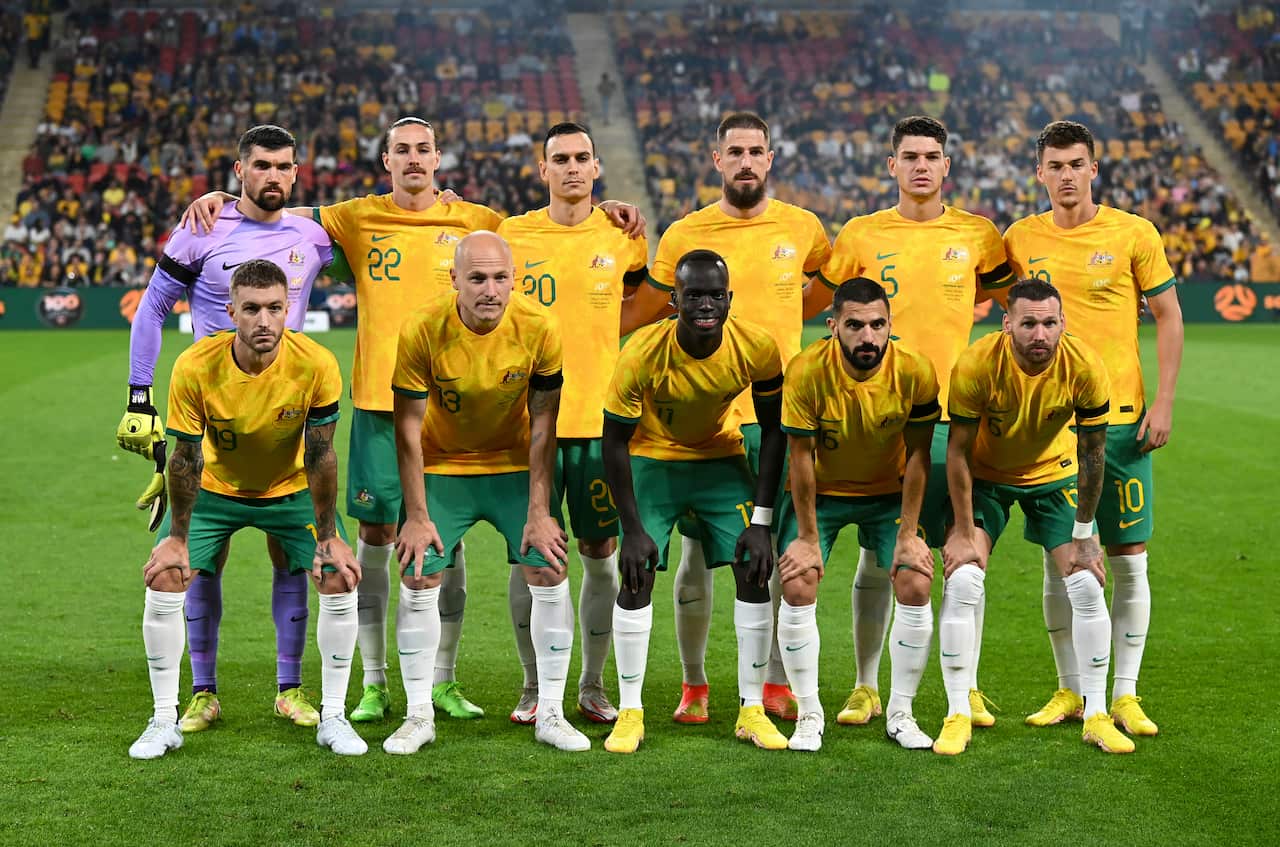 The Australian national soccer team, the Socceroos, pose for a photo before the start of a friendly soccer international against New Zealand in Brisbane, Australia, Thursday, Sept. 22, 2022. (AAP Image/AP Photo/Dan Peled). 