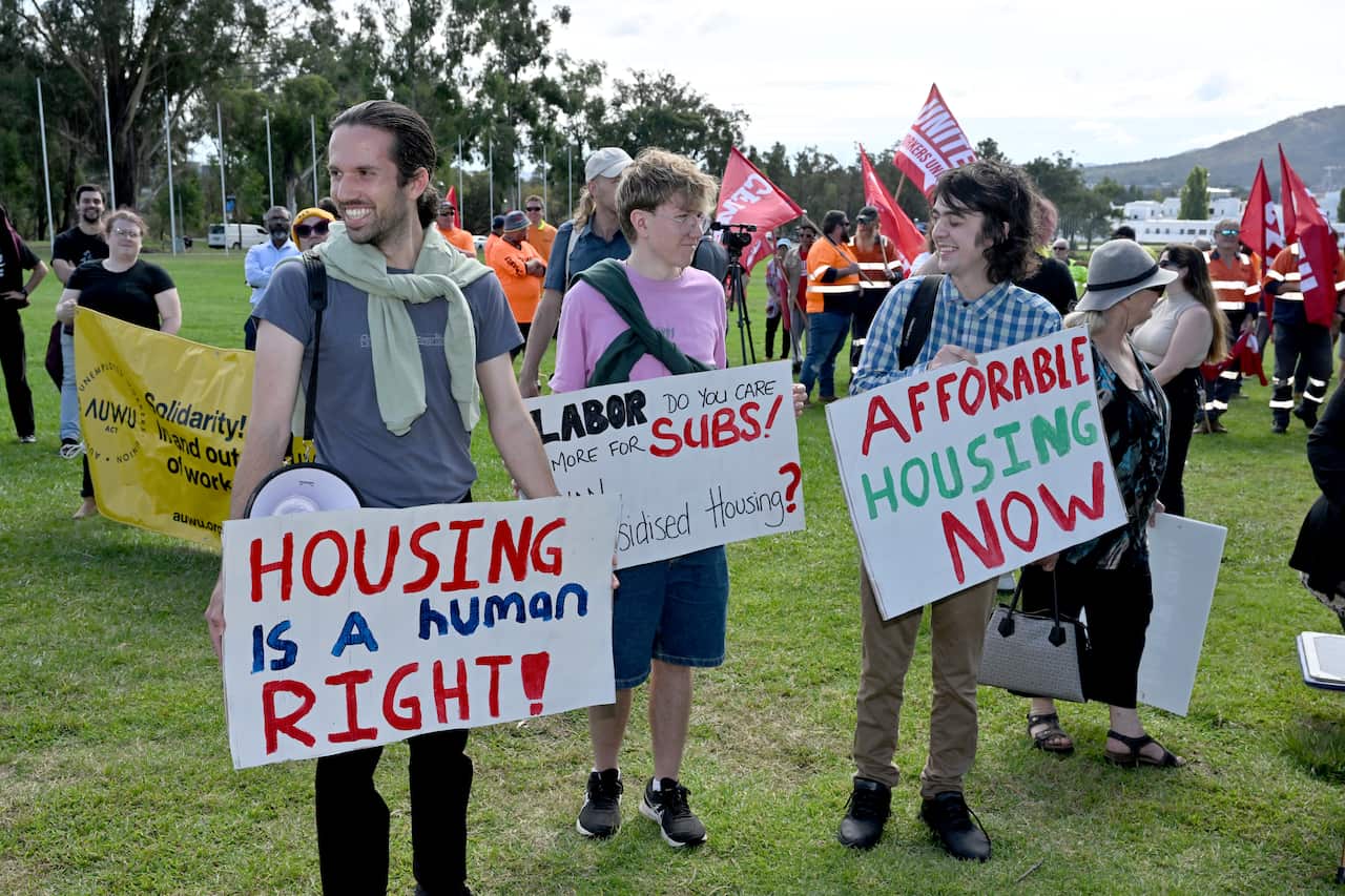Young people protesting on the lawns of Parliament House for more public and affordable housing