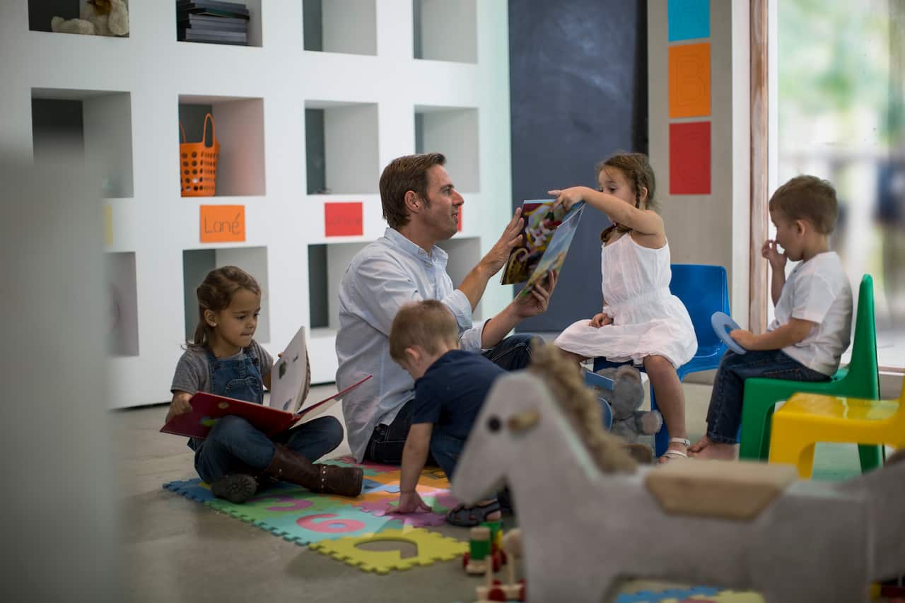 Teacher reading to children